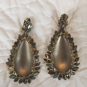 Alexis Bittar statement earrings one stone is missing reflected in price.